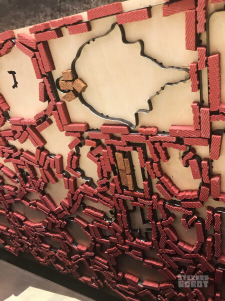 CLose up of hand made metal dies for custom silkscreen sticker printing