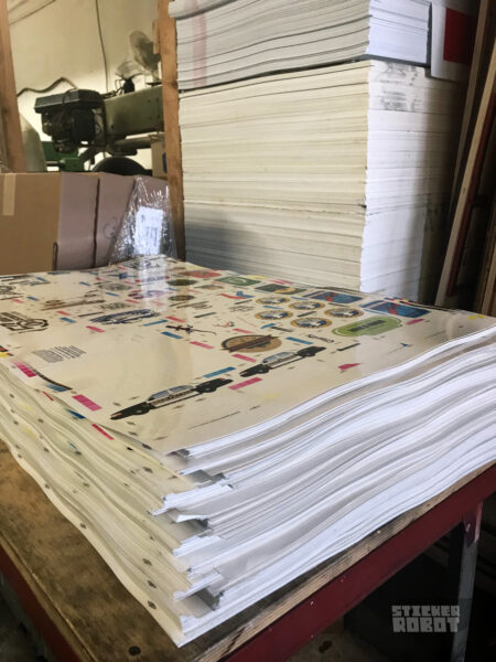 Sheets of press-ready film for silkscreen printed stickers from a gang run